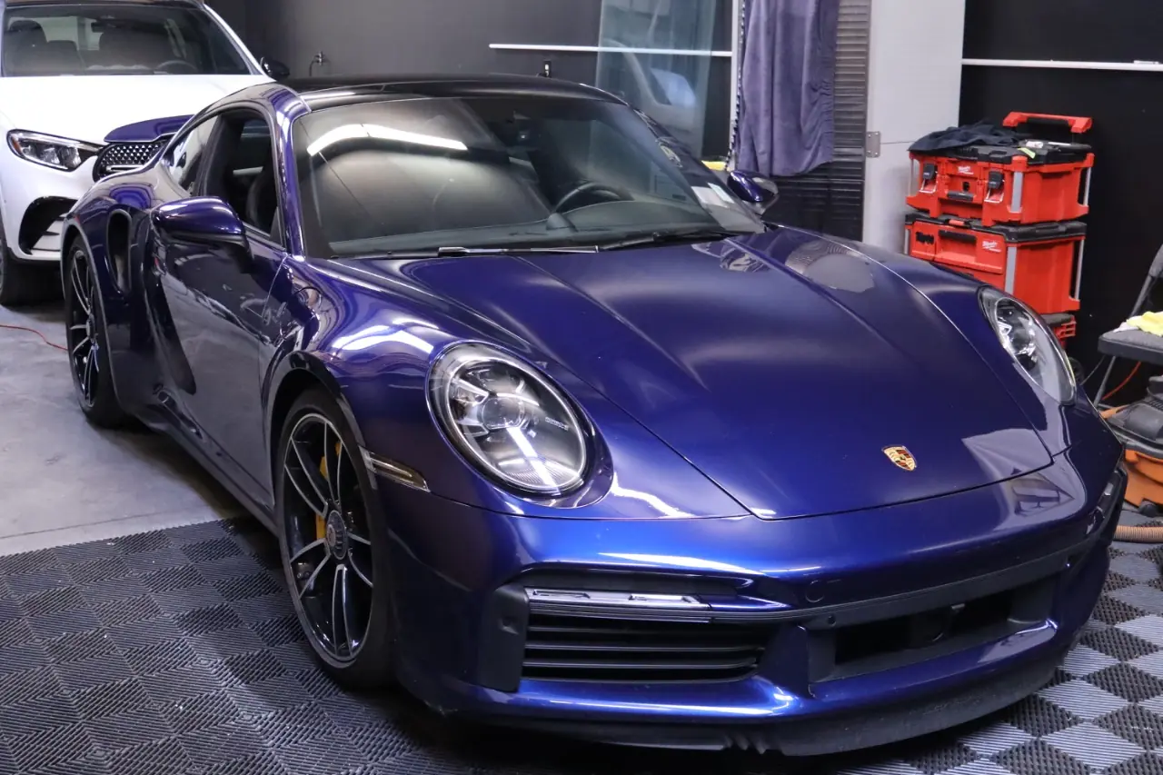A customer's Porsche 911 Turbo S finished and standing in the Evo Solutions install bay in Albuquerque